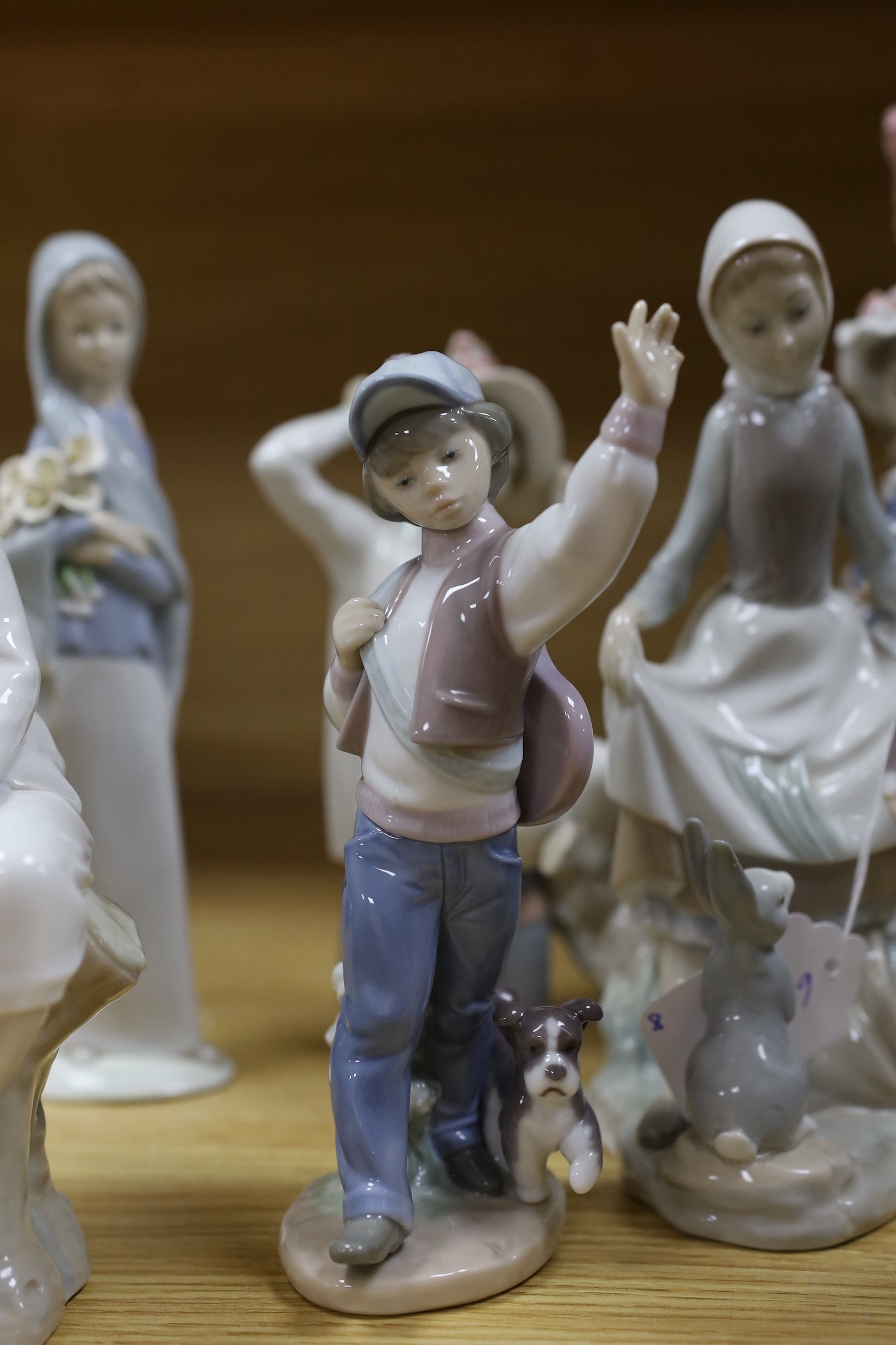 A selection of eight Lladro figures, tallest 33cm